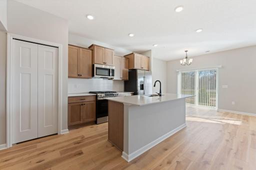 Bright, open living room designed for comfortable everyday living. Photo is for representational purposes only, not the actual home.