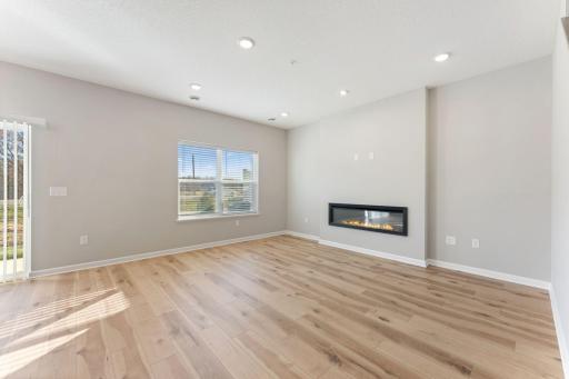 Bright, open living room designed for comfortable everyday living. Photo is for representational purposes only, not the actual home.