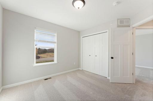 Comfortable secondary bedroom with flexible living possibilities. Photo is for representational purposes only, not the actual home.
