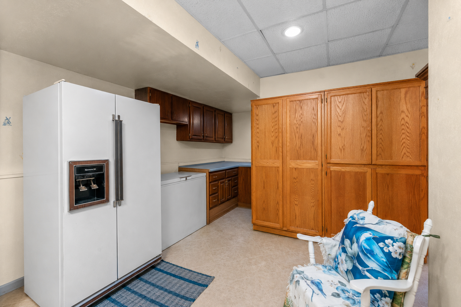 Cabinets, counter and sink in the lower level flex space / craft room / game room