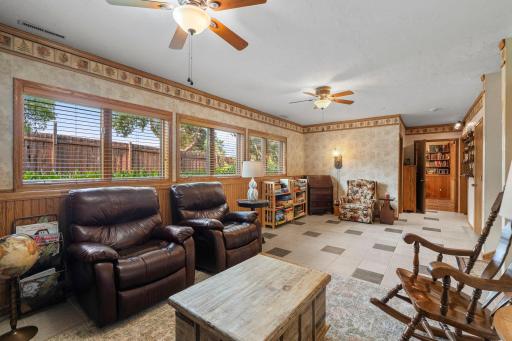Lower-level family room with a view to a lower-level bedroom