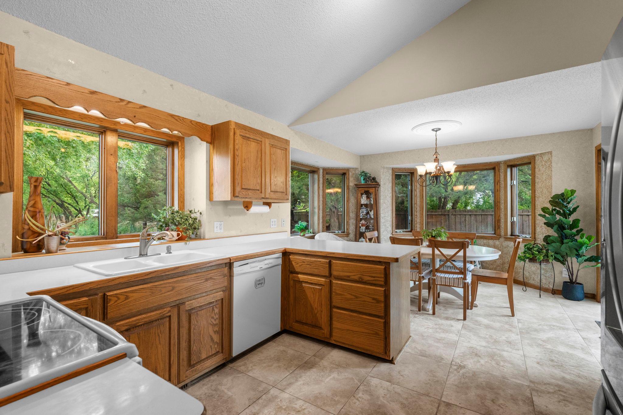 Kitchen with vaulted ceilings, lots of light and windows