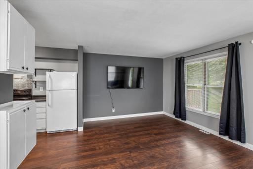 This versatile space just off the kitchen can be used as a comfortable living room or a dining area to suit your needs.