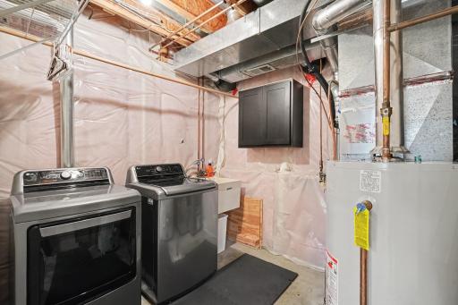 Well-Maintained Utility Room Featuring Newer Mechanicals, Washer and Dryer