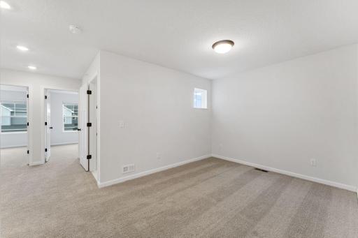 Versatile loft space perfect for relaxing, working, or entertaining. Photo is for representational purposes only, not the actual home.
