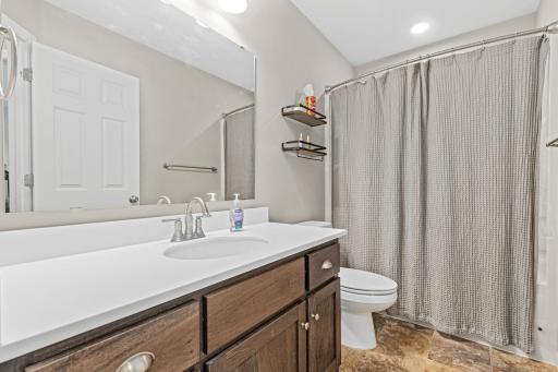 A third full bath completes the lower level.