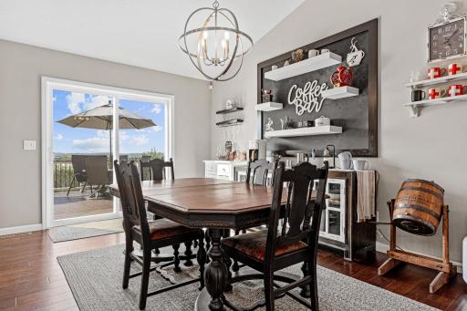 A dedicated dining space with coffee bar and deck access
