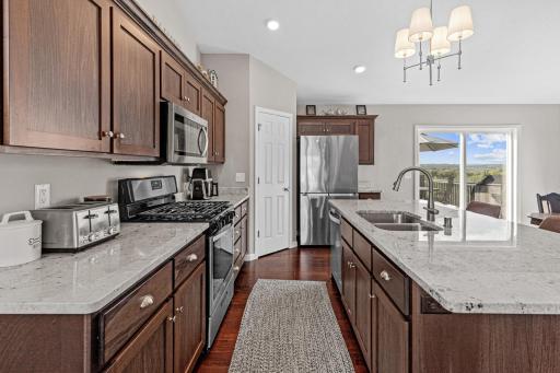 Gas stove, walk-in pantry, and tons of cabinets