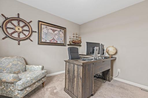 Main level bedroom 2 set up as a home office