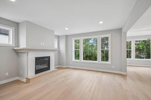 Oversized Windows Throughout the Main Level Give Natural Light and Elegance to the Home