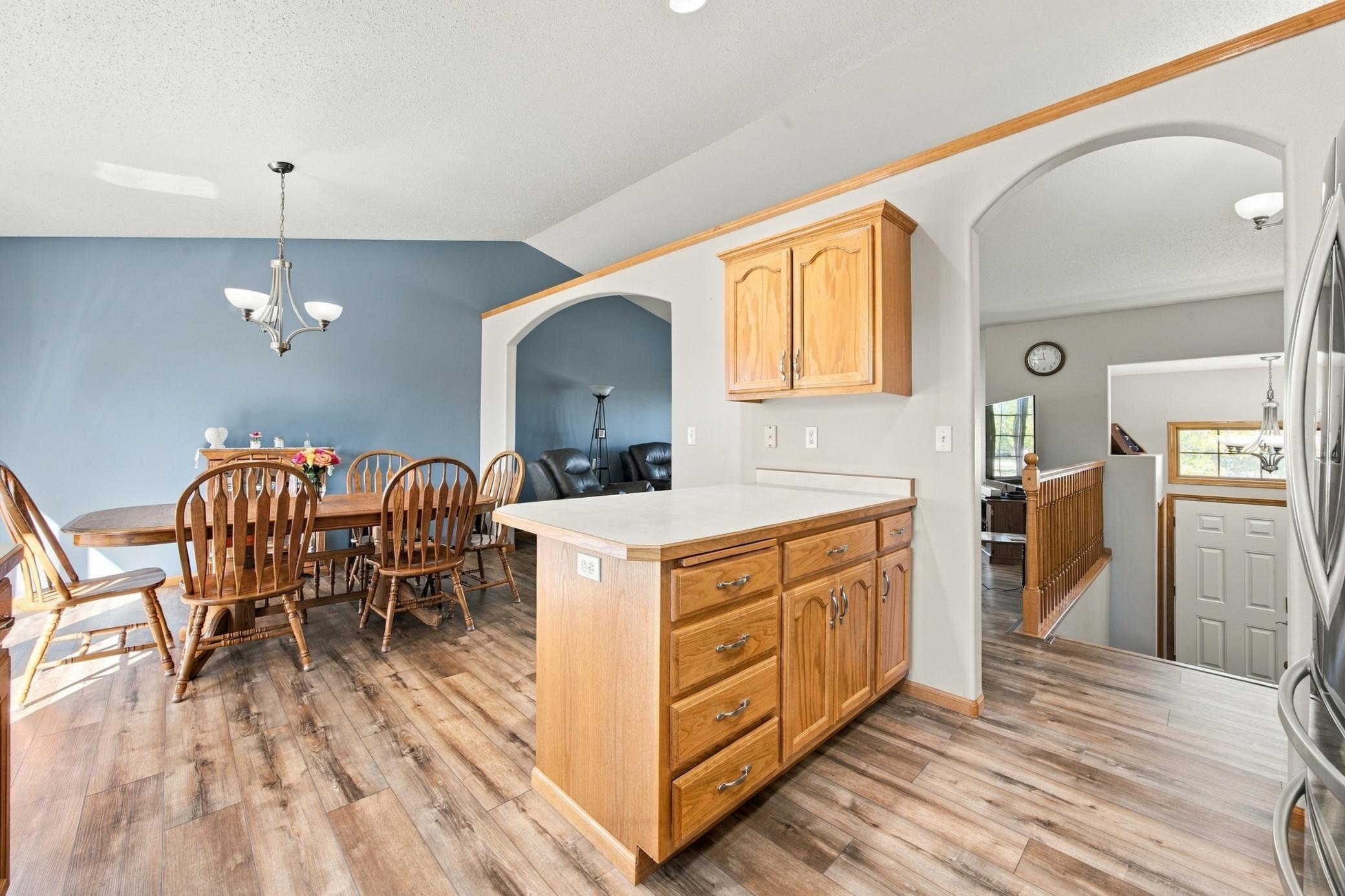 Kitchen view to Dining and Upper Level Living/Foyer