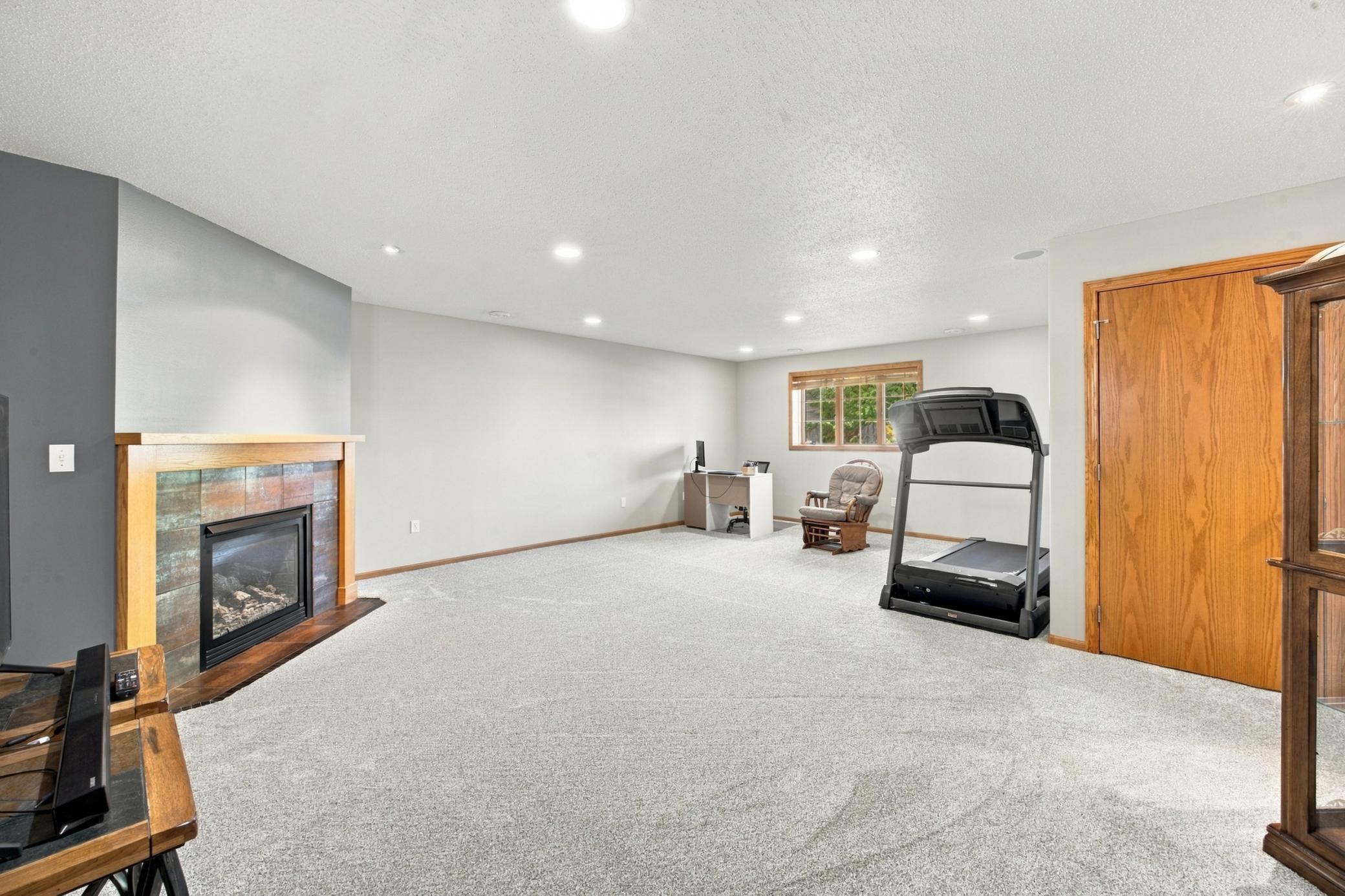 Family Room (Lower Level) with Tile Surround Gas Fireplace