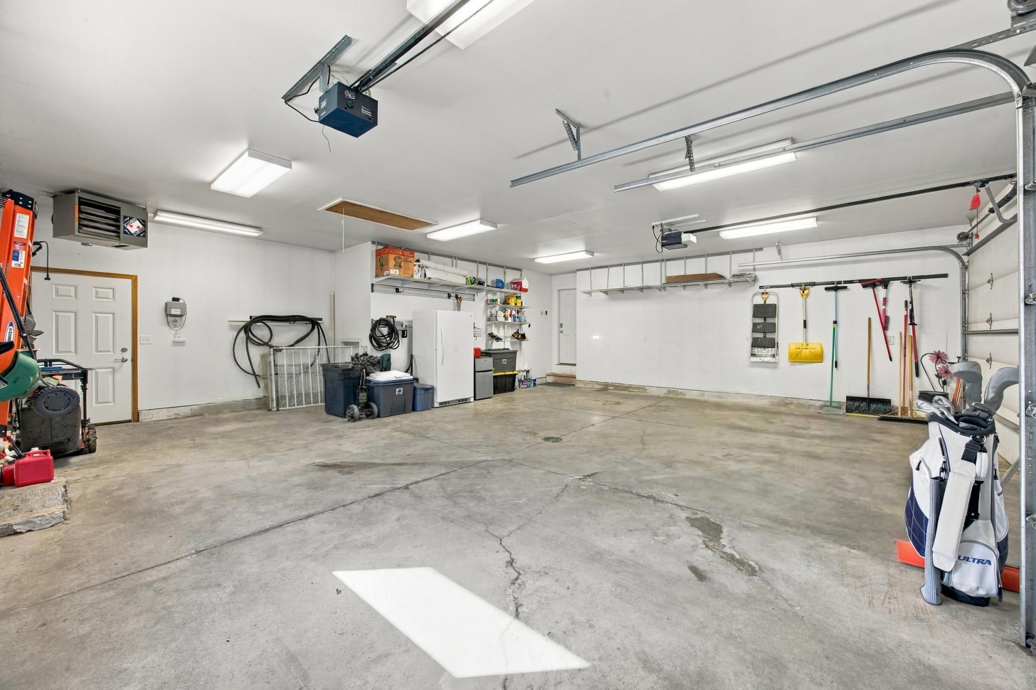 3-Stall Attached Garage (Oversized, Gas Heated, Floor Drain, Hot/Cold Water Spigot)