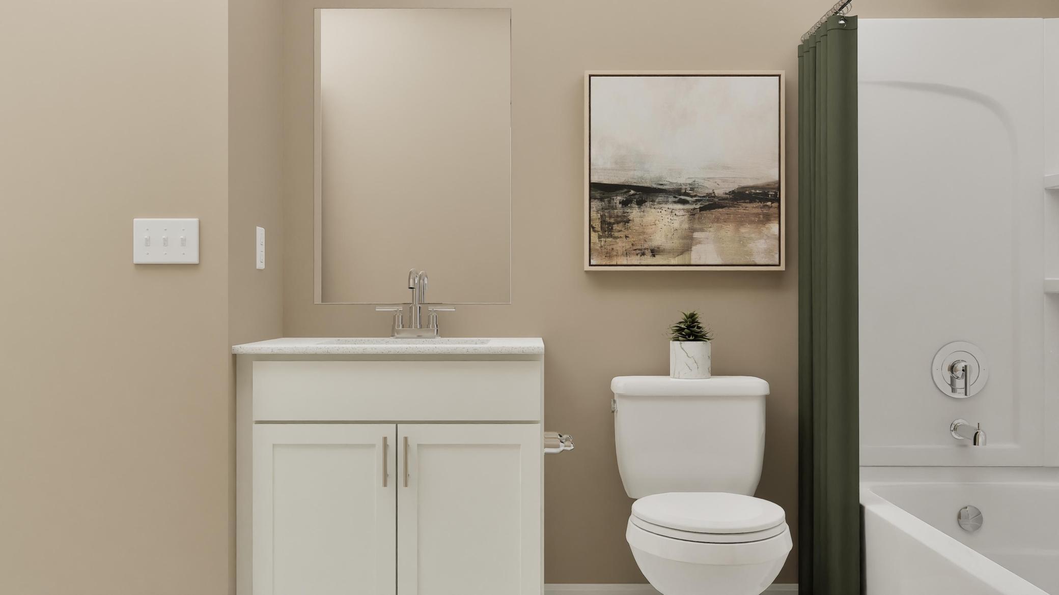 (Rendering, actual home's finishes will vary.) Situated near all the secondary bedrooms, this bathroom offers a stylish vanity and a shower-tub combination to maximize space.