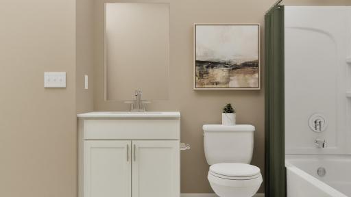 (Rendering, actual home's finishes will vary.) Situated near all the secondary bedrooms, this bathroom offers a stylish vanity and a shower-tub combination to maximize space.