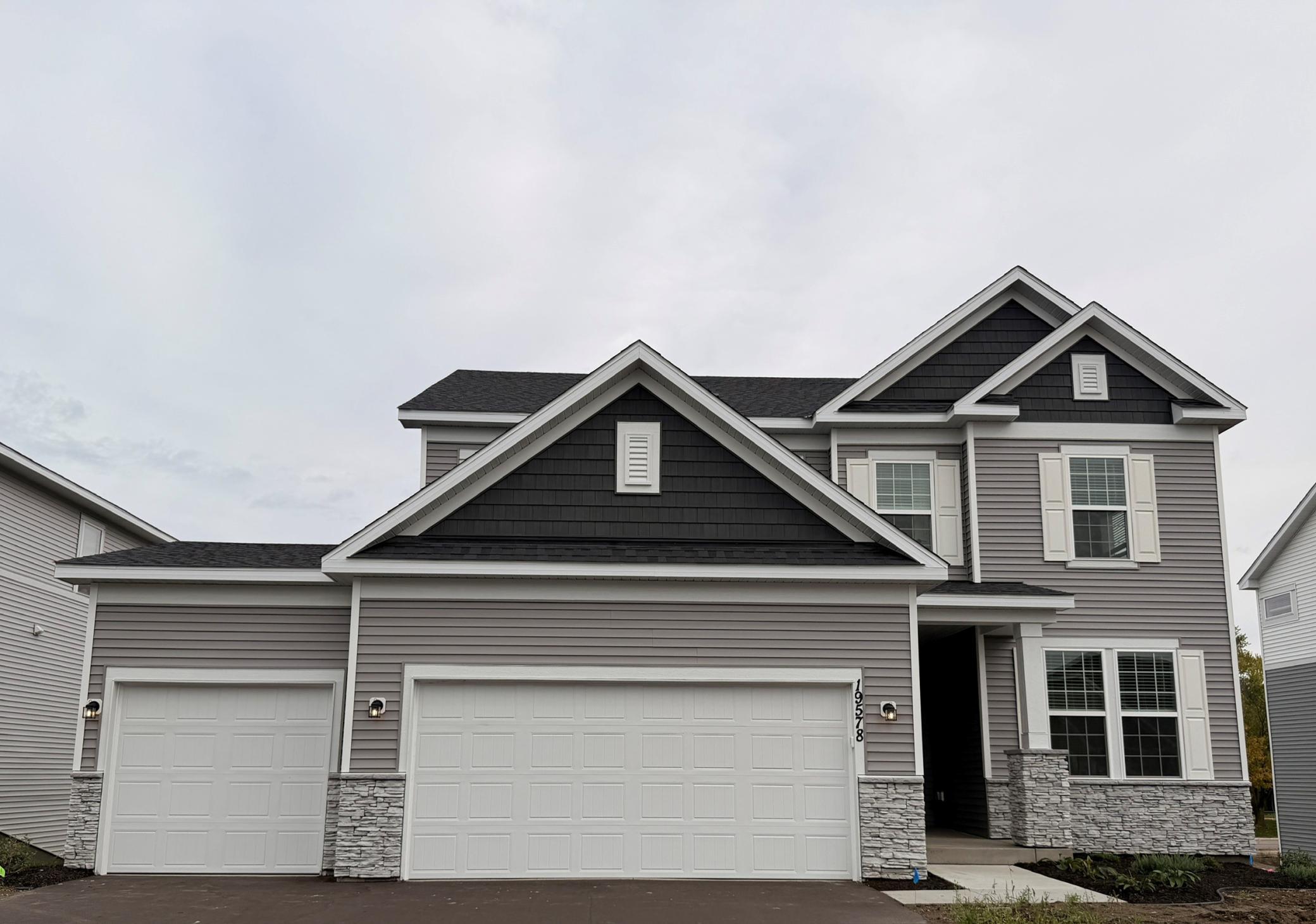 Striking curb appeal with clean lines and modern architectural design. The well-manicured landscaping complements the sleek exterior finishes, creating a welcoming and polished first impression.