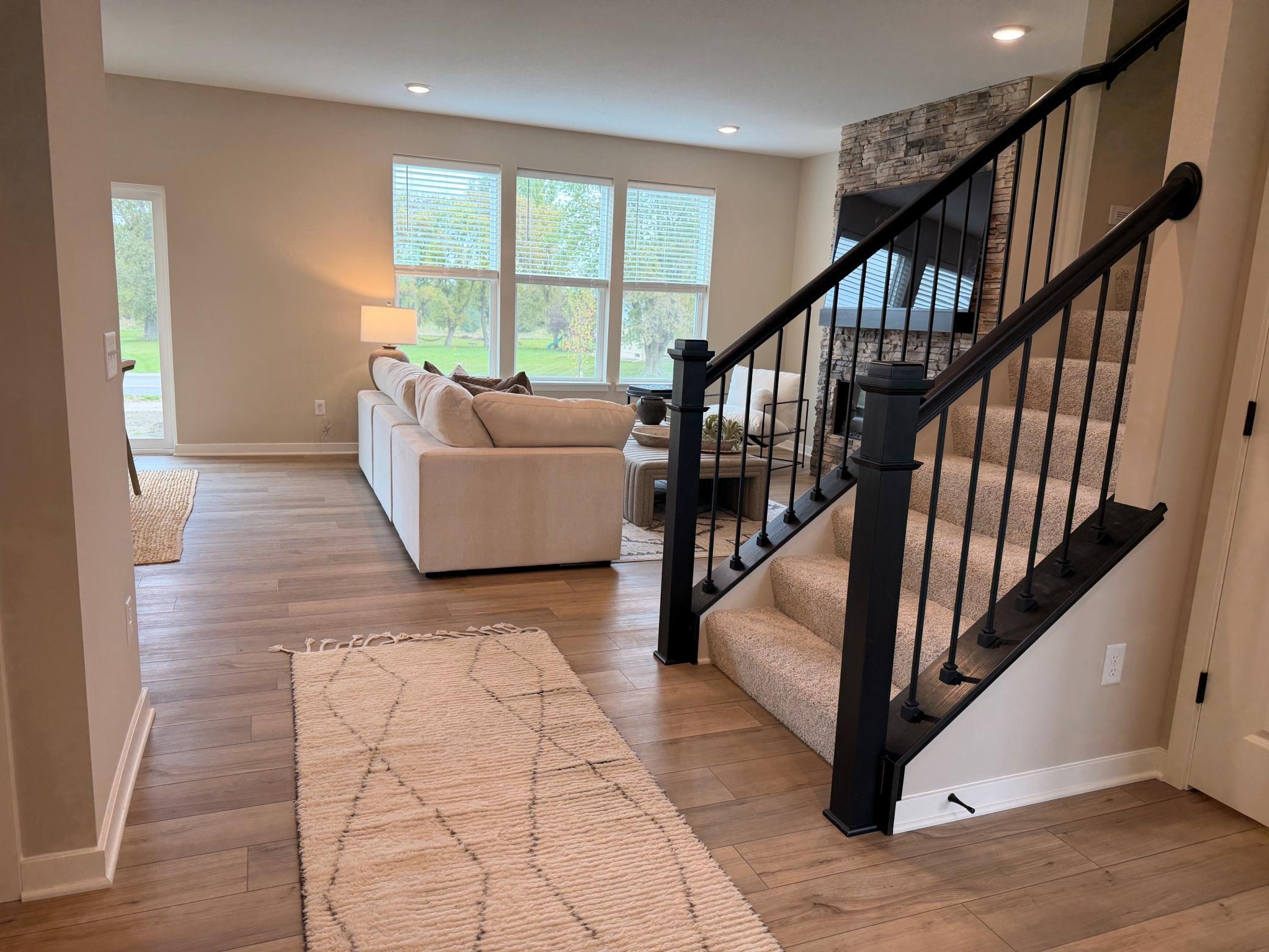 The welcoming entryway sets the tone for the home with clean lines, natural light, and inviting finishes.