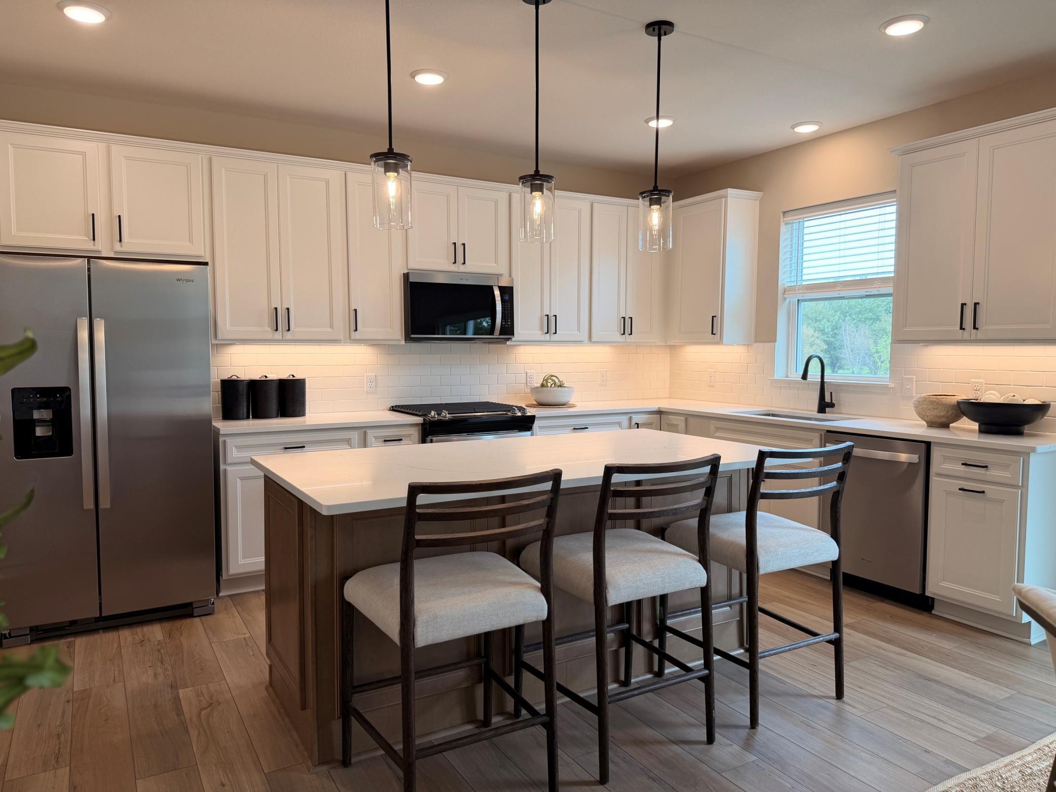 Bright and spacious kitchen featuring ample cabinetry, sleek countertops, and a functional layout—perfect for everyday living and entertaining.