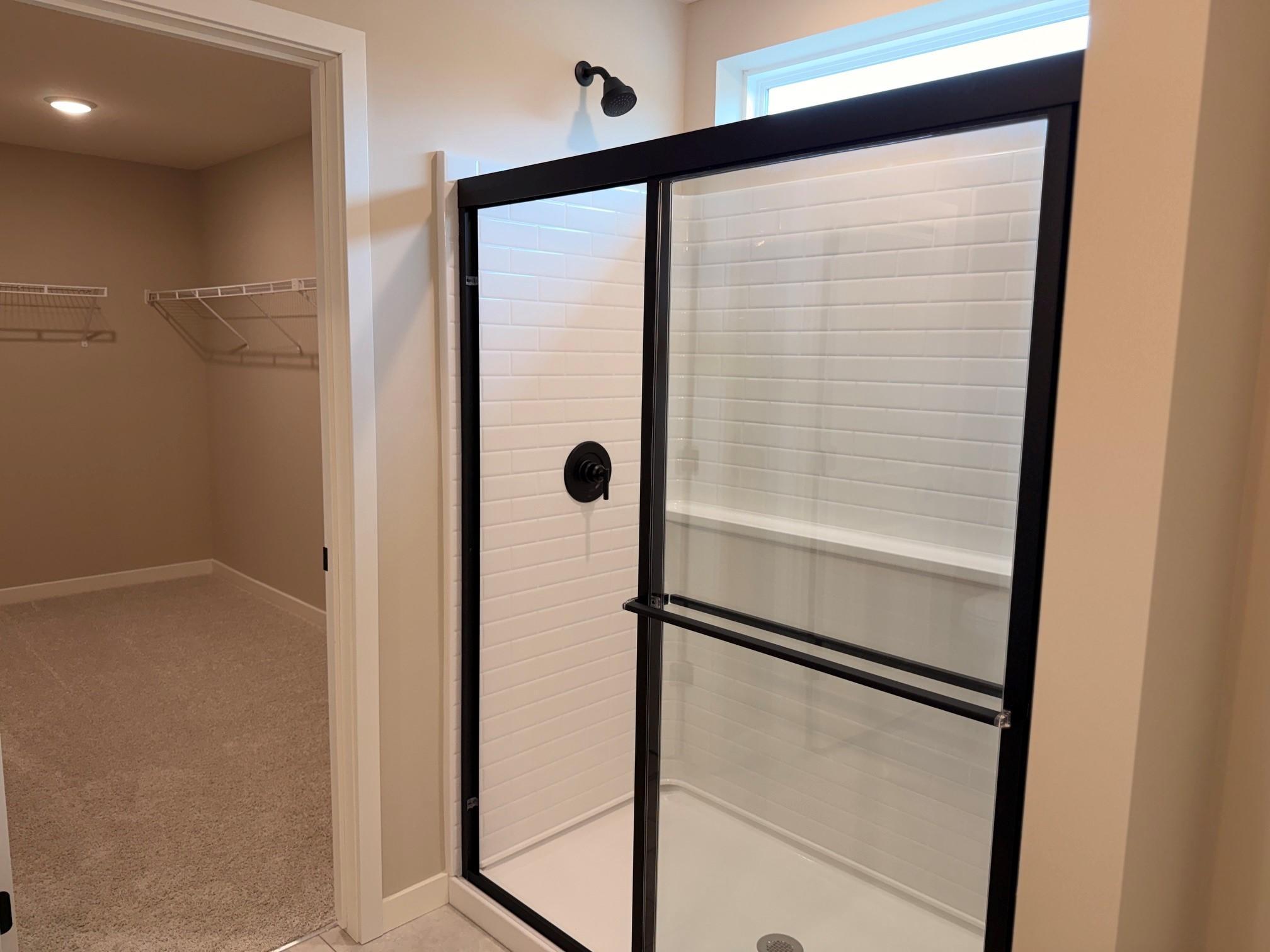 Beautifully designed primary ensuite bathroom offering a private,