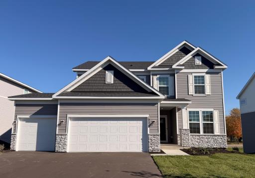 Striking curb appeal with clean lines and modern architectural design. The well-manicured landscaping complements the sleek exterior finishes, creating a welcoming and polished first impression.