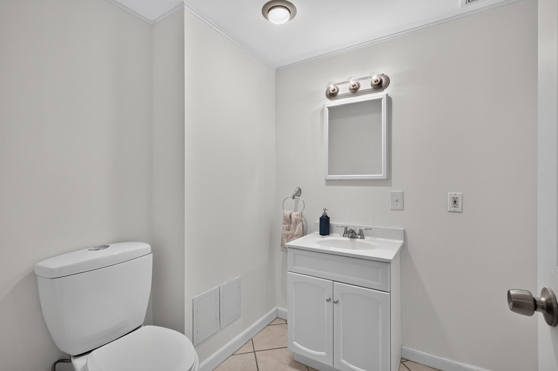 The lower level bathroom is freshly painted!