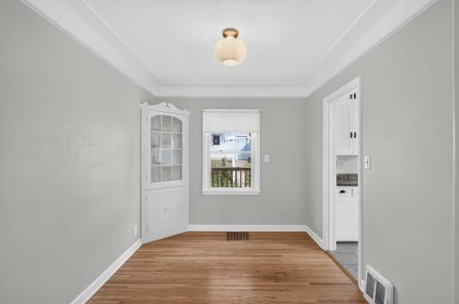 The formal dining room features a beautiful built-in and easy access to your kitchen