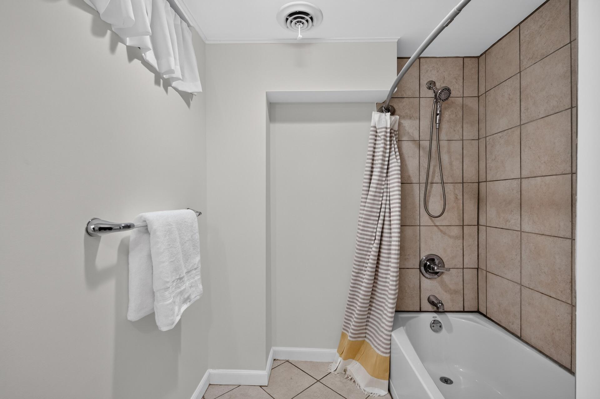 Tiled shower in the lower level bedroom