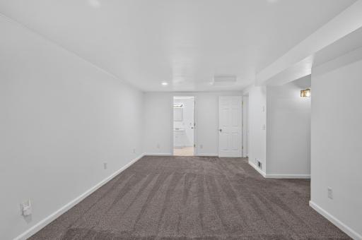 Off the family room is the full bathroom and a spacious non-conforming bedroom