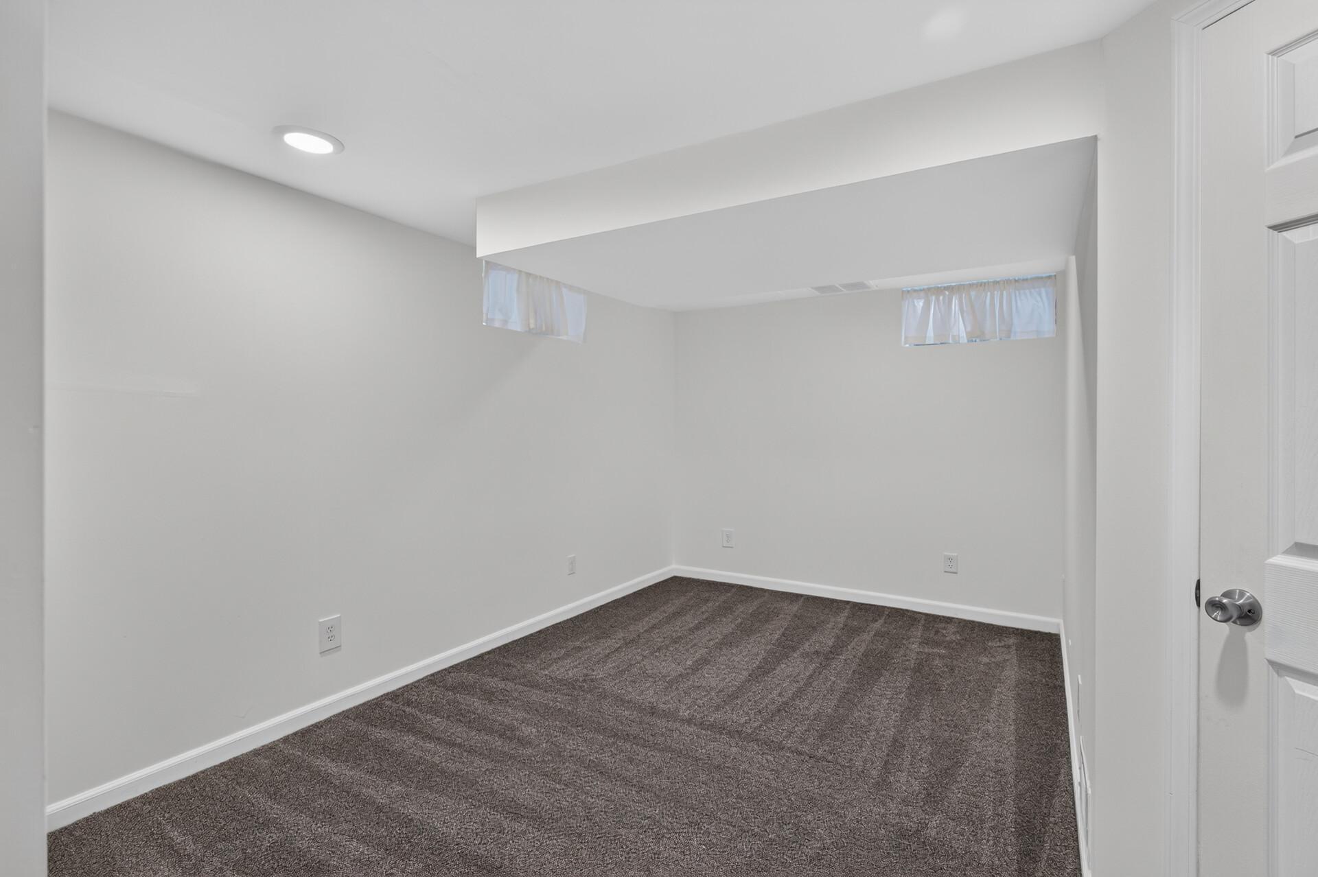 Oversized lower level den - just needs an egress window to become a 4th bedroom!