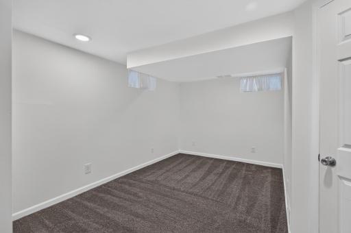 Oversized lower level den - just needs an egress window to become a 4th bedroom!