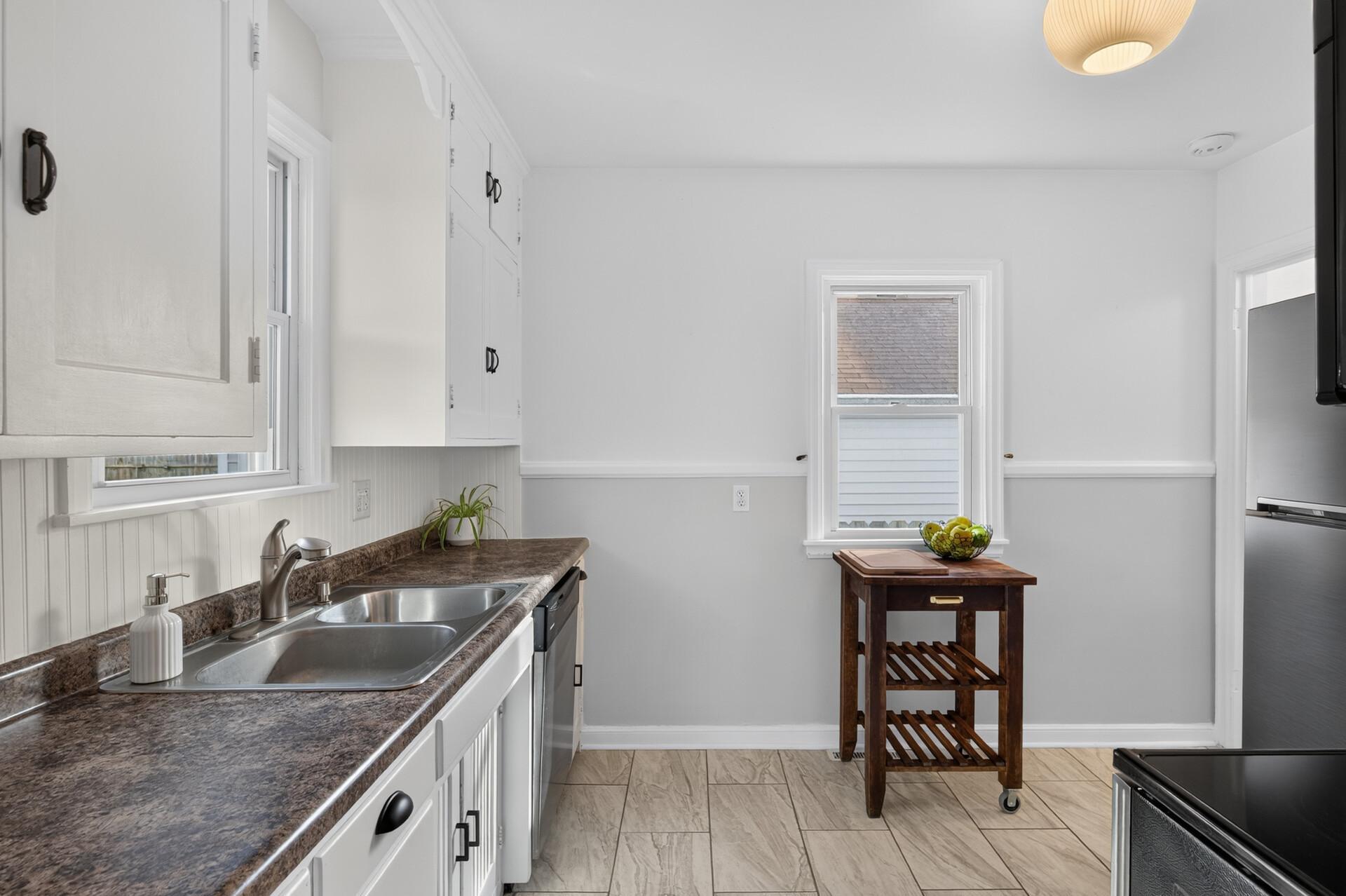 The spacious kitchen has plenty of prep space and gets great natural light!