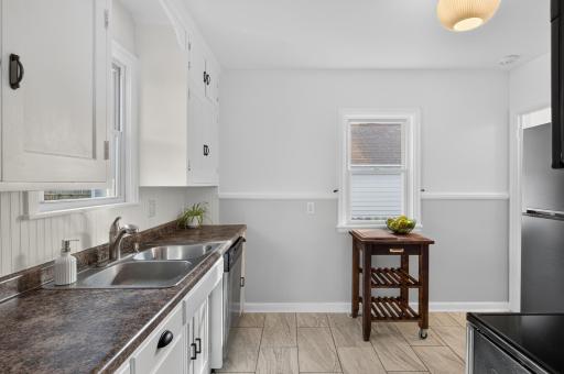 The spacious kitchen has plenty of prep space and gets great natural light!