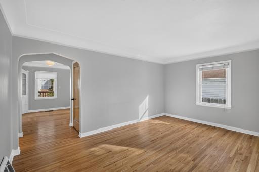 Off the living room is the formal dining room, the door to the upper level bedroom, and access to your main level bedrooms - let's go take a look!