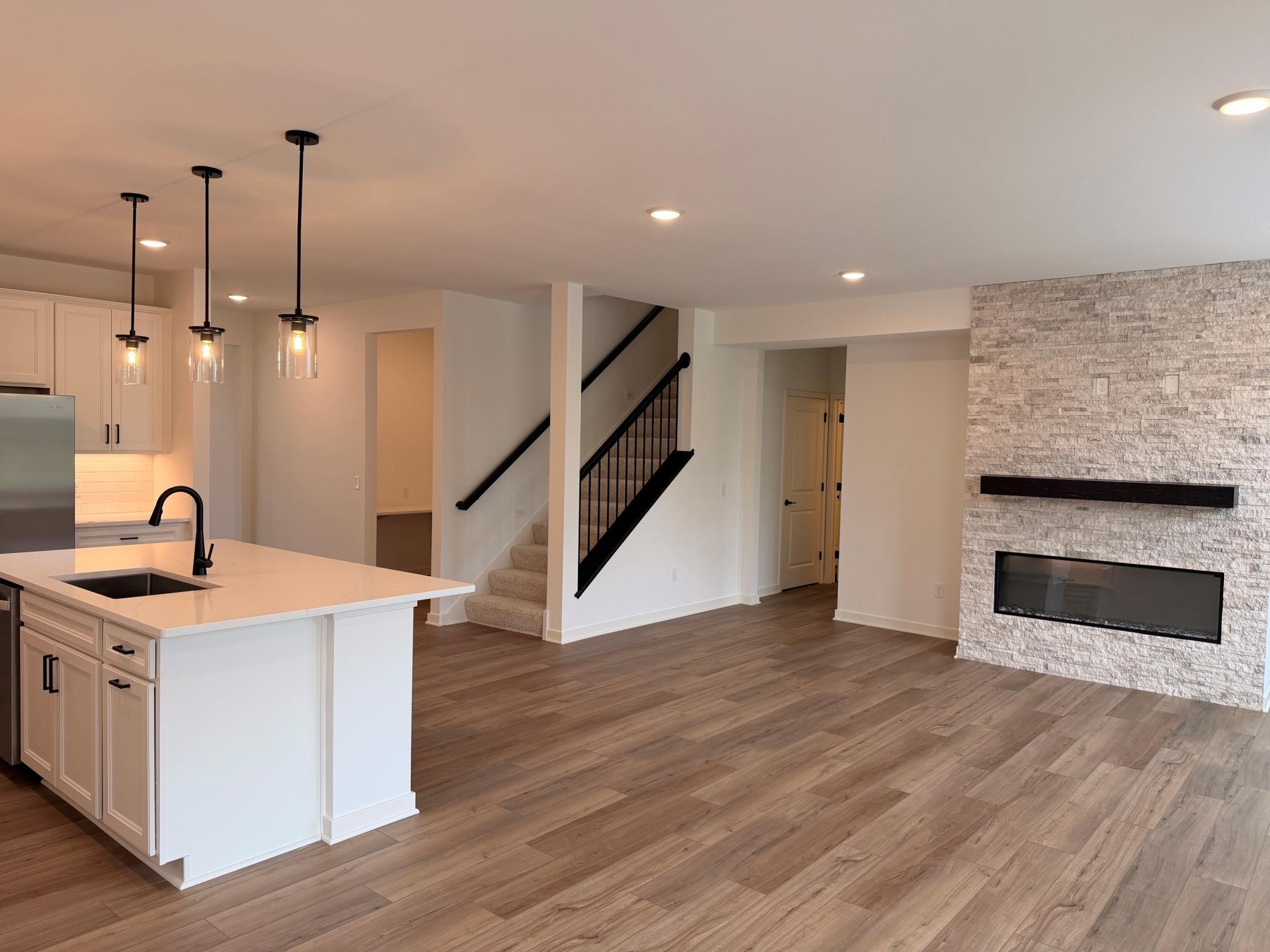 Open-concept design allows seamless flow from the kitchen to dining and living spaces—ideal for hosting and connection.