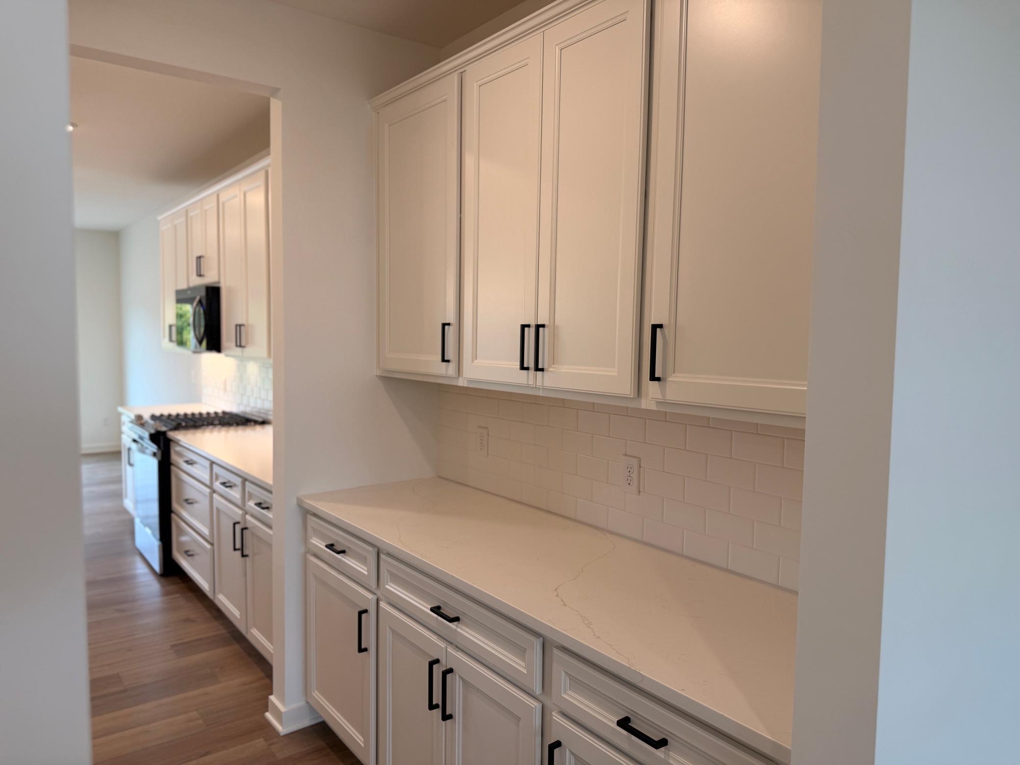The dining area’s location within the open floorplan provides easy access to the kitchen, living area, and outdoor spaces, perfect for indoor-outdoor living.