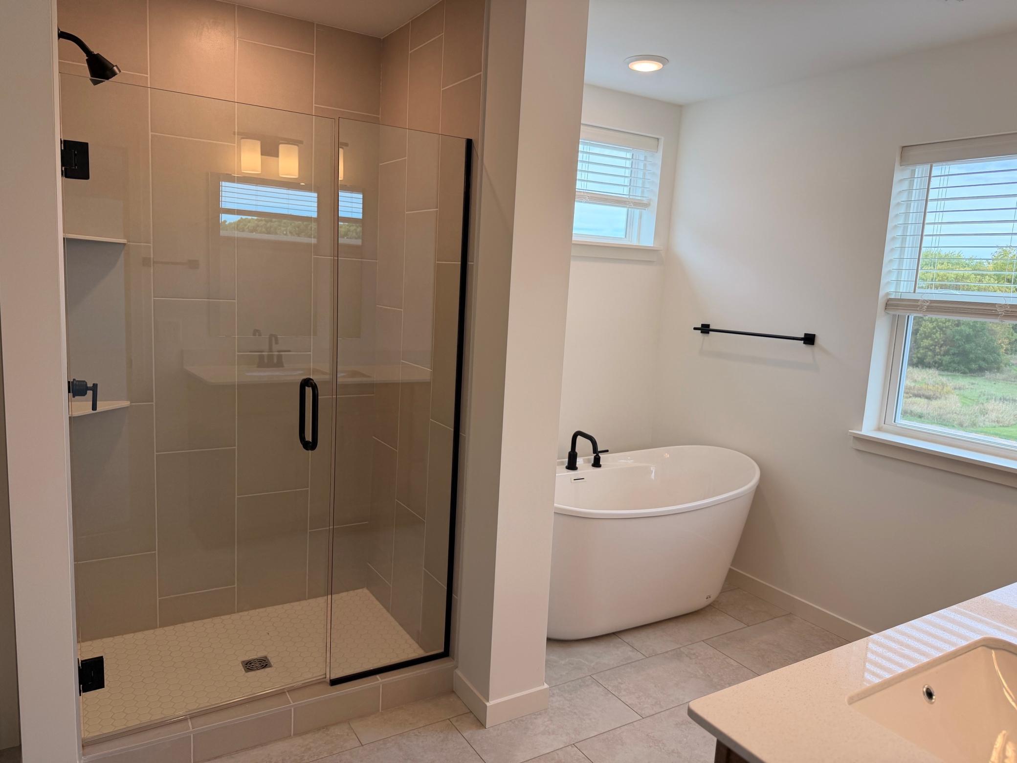 Beautifully designed primary ensuite bathroom offering a private, spa-like retreat complete with a spacious layout and high-end finishes.
