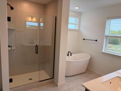 Beautifully designed primary ensuite bathroom offering a private, spa-like retreat complete with a spacious layout and high-end finishes.