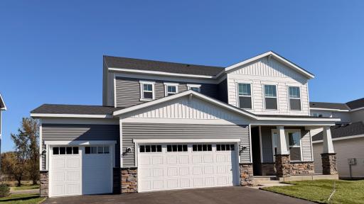 Striking curb appeal with clean lines and modern architectural design. The well-manicured landscaping complements the sleek exterior finishes, creating a welcoming and polished first impression.