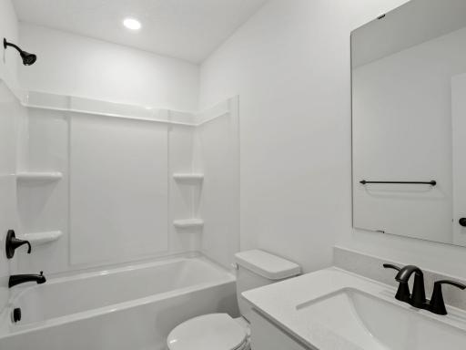 This upper-level full bathroom features an undermount sink with MoenÂ® faucet and a combination tub and shower for style and convenience.