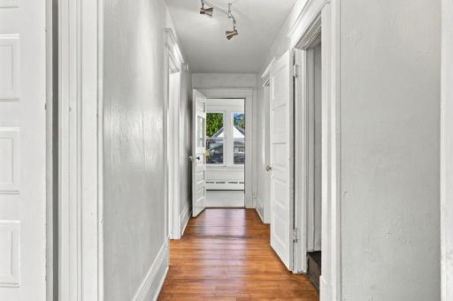 Hallway on the 2nd level provides access to 4 bedrooms, full bathroom and stairway to the third level.