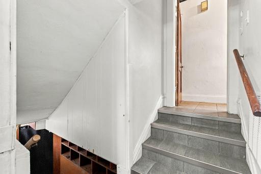 Coming in off the side foyer is access to the lower level and the kitchen.