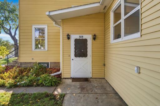 Side door has access to a coat closet and easy access to the lower level.