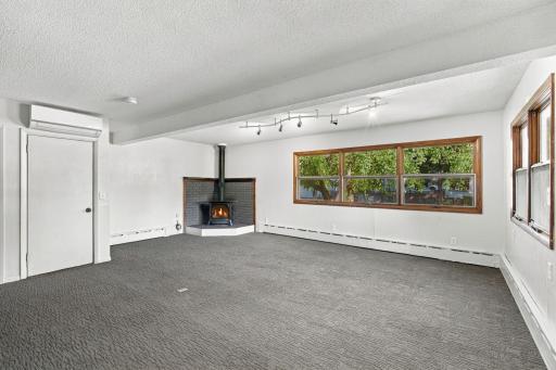 Large family room located right off the attached garage. Corner gas fireplace creates a cozy feel on those cool winter evenings.