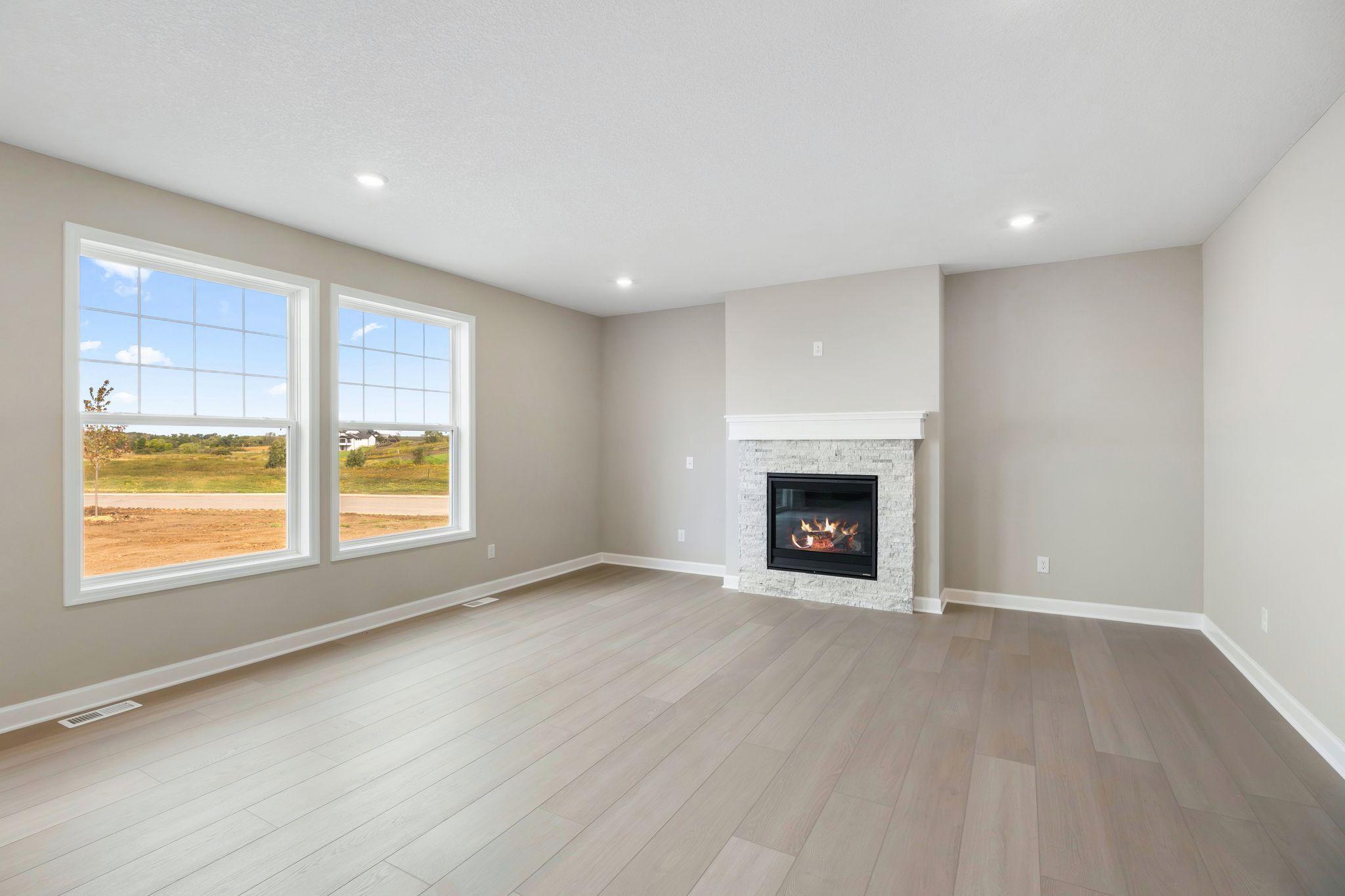 The Great Room features large windows for ample natural light and is the perfect place for gathering with friends and family.