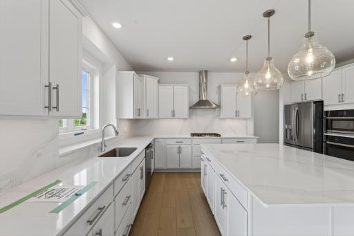 (Photo of a similar home, actual homes finished will vary) Another view of the gourmet kitchen.