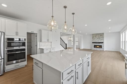 (Photo of a similar home, actual homes finished will vary) Soaked in natural sunlight, the home's eat-in dining room has ample space for a dining table located in the heart of the home.