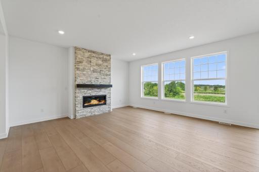 (Photo of a similar home, actual homes finished will vary) Cozy up next to the fireplace in your great room.