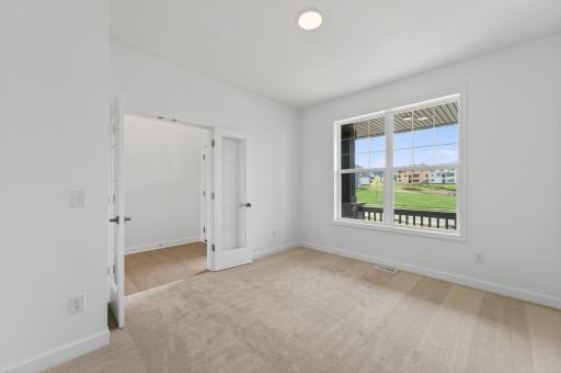 (Photo of a similar home, actual homes finished will vary) Located just off the foyer, this office space is perfect for those who work from home.