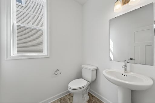 (Photo of a similar home, actual homes finished will vary) Main level powder bath.