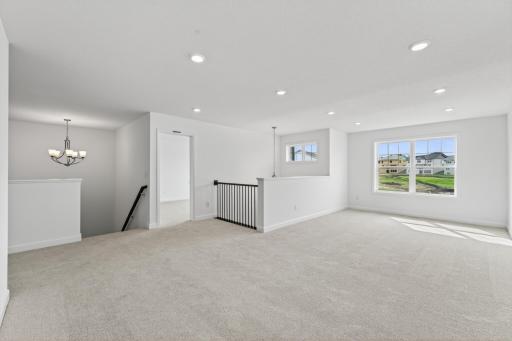 (Photo of a similar home, actual homes finished will vary) Relax, play, and enjoy in the loft!